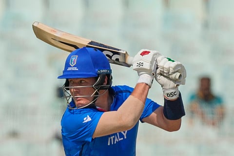 Italy's Harry Manenti plays a shot during the T20 World Cup cricket match between Italy and Scotland in Kolkata.