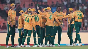 Photo: AP : South Africa's Lungi Ngidi, third from right, celebrates with teammates the wicket of Canada's Yuvraj Samra during the T20 World Cup match between Canada and South Africa in Ahmedabad.