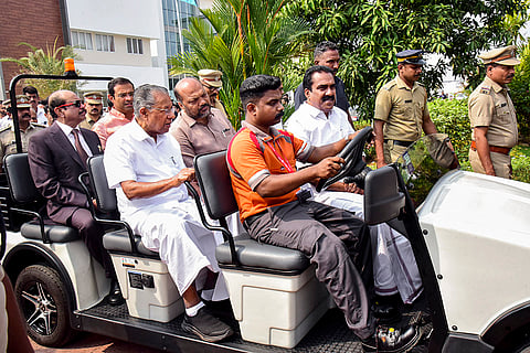 Kerala Chief Minister Pinarayi Vijayan travels in an open electric vehicle to attend the inauguration of the newly constructed CIAL Aero Park at Cochin International Airport, in Kochi. Ministers P. Rajeeve, M.A. Yusuff Ali, MLA Anwar Sadath and MLA Roji M. John are also seen. 