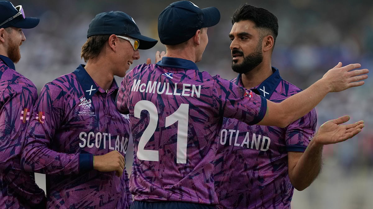 Scotland's Safyaan Sharif, right, celebrates with teammates the wicket of West Indies' Shimron Hetmyer during the T20 World Cup cricket match between Scotland and West Indies in Kolkata, India, Saturday, Feb. 7, 2026.  - | Photo: AP/Bikas Das