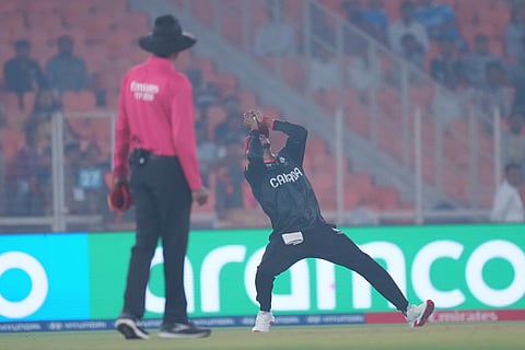 Canada's Nicholas Kirton takes the catch to get South Africa's Dewald Brevis during the T20 World Cup cricket match between Canada and South Africa in Ahmedabad.