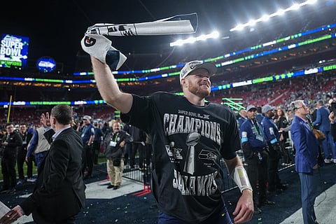Seattle Seahawks quarterback Sam Darnold celebrates after a win over the New England Patriots in the NFL Super Bowl 60 football game in Santa Clara, California.
