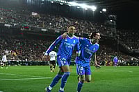 Valencia 0-2 Real Madrid, La Liga 2025-26: Kylian Mbappe Seals Win After Carreras Breakthrough | Photo: AP/Francisco Macia : Real Madrid's Kylian Mbappe, left, celebrates with Alvaro Carreras after scoring his side's second goal during the Spanish La Liga soccer match between Valencia and Real Madrid in Valencia, Spain.