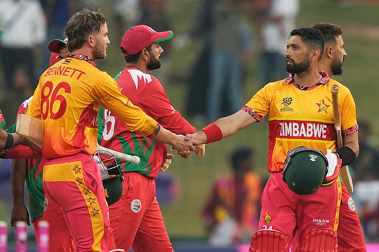 Zimbabwe's captain Sikandar Raza, right, Brian Bennett, left, celebrate after winning their T20 World Cup cricket match against Oman in Colombo, Sri Lanka. - | Photo: AP/Eranga Jayawardena