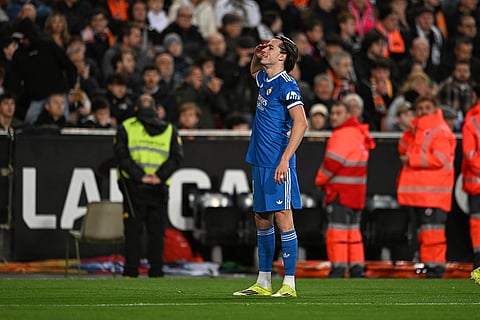 Real Madrid's Alvaro Carreras celebrates after scoring the opening goal during the Spanish La Liga soccer match between Valencia and Real Madrid in Valencia, Spain.