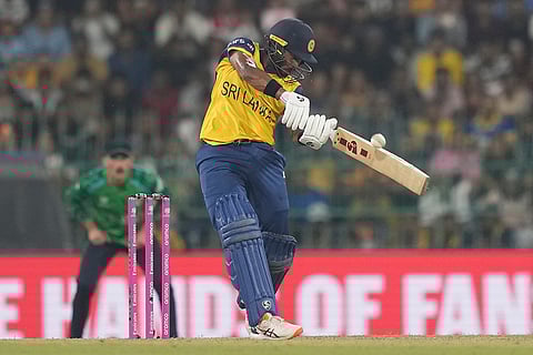 Sri Lanka's Kamindu Mendis hits a six during the T20 World Cup cricket match between Sri Lanka and Ireland in Colombo, Sri Lanka.