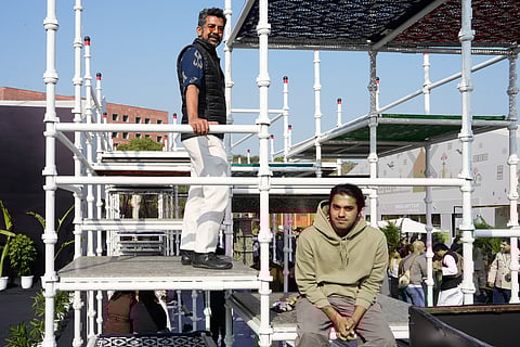 Curator Ayush Kasliwal and AI artist Goji (R) of The Charpai Project at the India Art Fair 2026