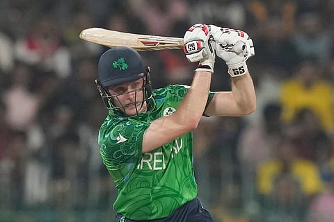 Ireland's Lorcan Tucker plays a shot during the T20 World Cup cricket match between Sri Lanka and Ireland in Colombo, Sri Lanka.