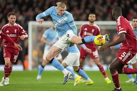 Manchester City's Erling Haaland receives the ball during the English Premier League soccer match between Liverpool and Manchester City in Liverpool, England.