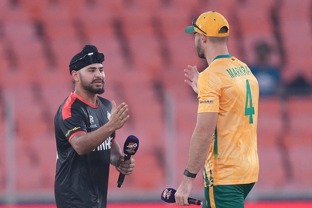 Canada's captain Dilpreet Bajwa, left, shake hands with South Africa's captain Aiden Markram after the toss of the T20 World Cup cricket match between Canada and South Africa in Ahmedabad. - | Photo: AP/Ajit Solanki
