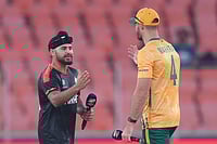 | Photo: AP/Ajit Solanki : Canada's captain Dilpreet Bajwa, left, shake hands with South Africa's captain Aiden Markram after the toss of the T20 World Cup cricket match between Canada and South Africa in Ahmedabad.