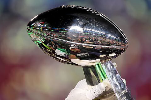 The Lombardi Trophy is raised after the Seattle Seahawks defeated the New England Patriots in the NFL Super Bowl 60 football game in Santa Clara, California.