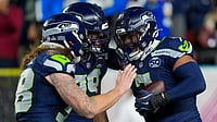 Patriots Vs Seahawks Highlights, NFL Super Bowl 2026: Seattle Dominate New England To Lift Lombardi Trophy | Photo: AP/Brynn Anderson : Seattle Seahawks linebacker Uchenna Nwosu, right, is congratulated by teammates after recovering a fumble and returning it for a touchdown during the second half of the NFL Super Bowl 60 football game against the New England Patriots, Sunday, Feb. 8, 2026, in Santa Clara, Calif.