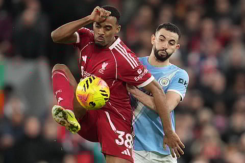 Liverpool's Ryan Gravenberch receives the ball in front of Manchester City's Rayan Ait-Nouri during the English Premier League soccer match between Liverpool and Manchester City in Liverpool, England.