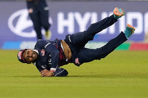 United States' Milind Kumar takes the catch to get Pakistan's Babar Azam during the T20 World Cup cricket match between Pakistan and the United States in Colombo, Sri Lanka.