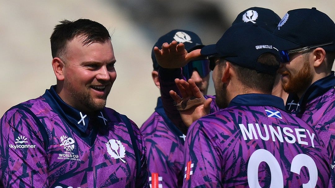 Scotland players celebrate a fall of wicket against Italy - X/CricketScotland