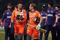 Netherlands Vs Namibia, ICC T20 World Cup 2026: De Leede’s All-Round Masterclass Leads Dutch To Convincing 7-Wicket Win | Photo: AP/Manish Swarup : Netherlands' captain Scott Edwards, left and Netherlands' Bas de Leede walks out of the field after their win over Namibia during the T20 World Cup cricket match between Namibia and Netherlands in New Delhi.