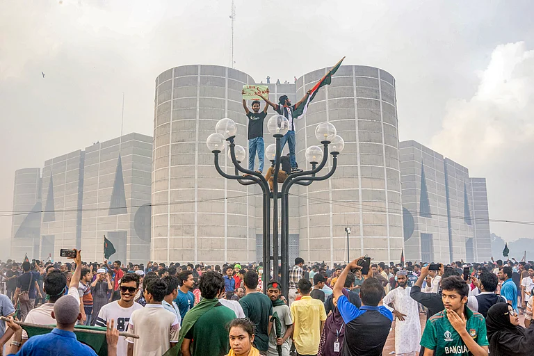 Anti-government protesters celebrate outside the Bangladesh Parliament after getting the news of Prime Minister Sheikh Hasina's resignation, in Dhaka, Bangladesh, Monday, Aug. 5, 2024. (AP Photo/Abid Hasan) - Rajib Dhar