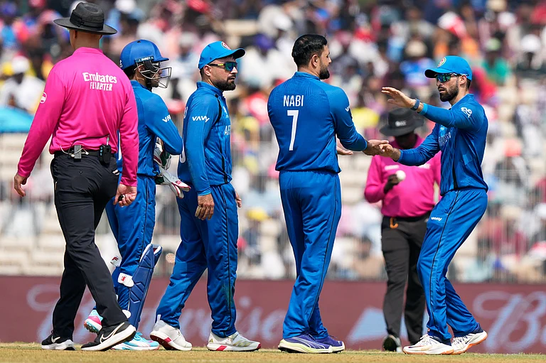 Afghanistan's Mohammad Nabi celebrates with teammates the wicket of New Zealand's Tim Seifert during the T20 World Cup cricket match between Afghanistan and New Zealand in Chennai, India, Sunday, Feb. 8, 2026. - | Photo: AP/Mahesh Kumar A.