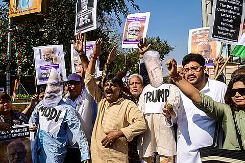 Congress members stage a protest against the new India-U.S. trade framework, in Kolkata.