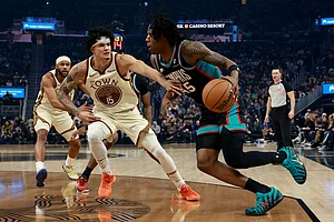 | Photo: AP/Jed Jacobsohn : Memphis Grizzlies forward GG Jackson (45) drives to the basket against Golden State Warriors forward Gui Santos (15) during the first half of an NBA basketball game in San Francisco.