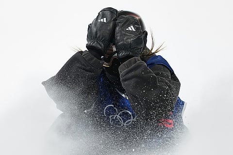 Britain's Mia Brookes reacts during the women's snowboarding big air finals at the 2026 Winter Olympics, in Livigno, Italy.