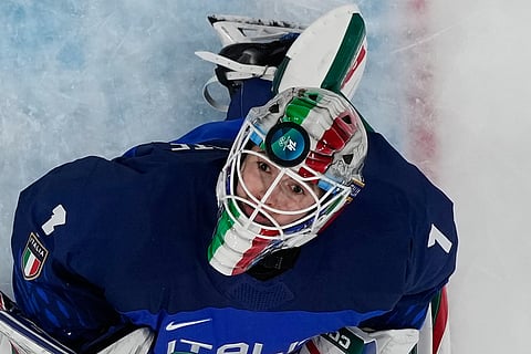 Italy's goalkeeper Gabriella Durante fails to save the puck as Japan's Akane Shiga scores her side's second goal during a preliminary round match of women's ice hockey between Japan and Italy at the 2026 Winter Olympics, in Milan, Italy.