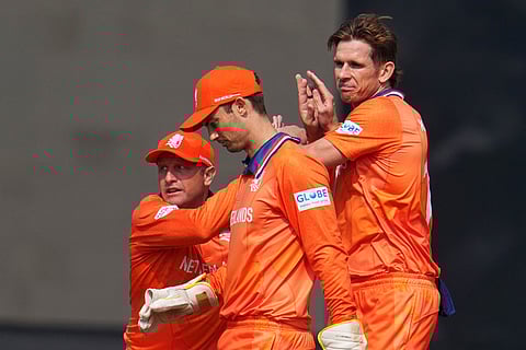 Netherlands' Fred Klaassen, right, celebrates with teammates after the dismissal of Namibia's Zane Green during the T20 World Cup cricket match between Namibia and Netherlands in New Delhi.