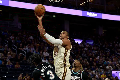 Golden State Warriors center Al Horford (20) shoots against Memphis Grizzlies guard Kentavious Caldwell-Pope (3) during the second half of an NBA basketball game in San Francisco.