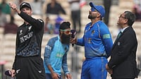 AP/Mahesh Kumar A. : New Zealand's captain Mitchel Santner, left, toss a coin as United Arab Emirates' captain Muhammad Waseem.