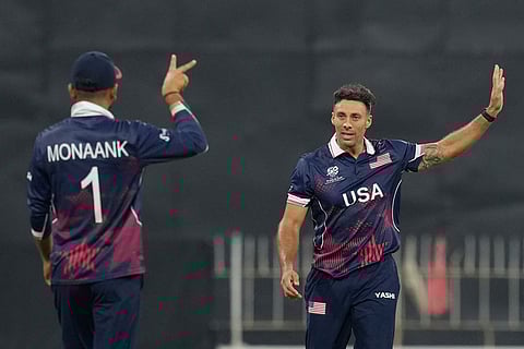 United States' Shadley Van Schalkwyk, right, celebrates with teammates the wicket of Pakistan's Shadab Khan during the T20 World Cup cricket match between Pakistan and the United States in Colombo, Sri Lanka.