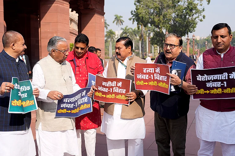 RJD MPs stage a protest in the Parliament premises over various issues during the Budget session, in New Delhi. - | Photo: PTI/Ravi Choudhary