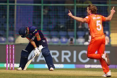 Namibia's JJ Smit bowled by Netherlands' Bas de Leede, right, during the T20 World Cup cricket match between Namibia and Netherlands in New Delhi.