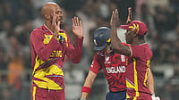 England Vs West Indies LIVE Score, T20 World Cup: Motie Snares Bethell To Peg Three Lions Back | ENG 99/4 (11) Photo: AP : West Indies' Roston Chase, left, celebrates with teammates the wicket of England's Jos Buttler during their T20 World Cup match in Mumbai.