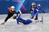 2026 Winter Olympics: Check Best Photos From Day 4 Events At Cortina | Photo: AP/Francisco Seco : Corinne Stoddard of the United States wipes out as Xinran Wang of the People's Republic of China moves past to win while competing in the women's 500 meter short track speed skating at the 2026 Winter Olympics, in Milan, Italy.