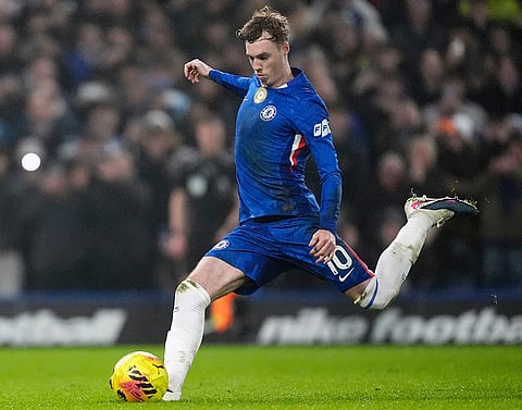 Chelsea's Cole Palmer, right, winds up to score his side's second goal from a penalty during an English Premier League soccer match against against Leeds United, in London.