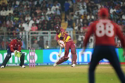 West Indies' Roston Chase hits a boundary during the T20 World Cup cricket match between England and West Indies in Mumbai, India.