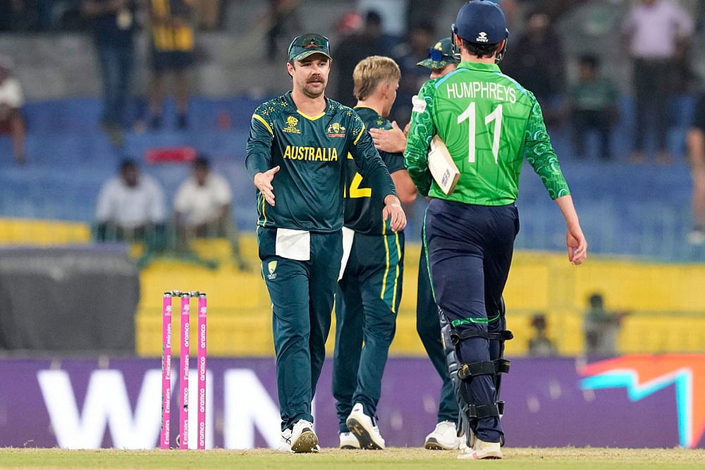 Australia's captain Travis Head, left, walks to shake hands with Ireland's Matthew Humphreys after Australia won the T20 World Cup cricket match against Ireland in Colombo, Sri Lanka. - Photo: AP/Eranga Jayawardena