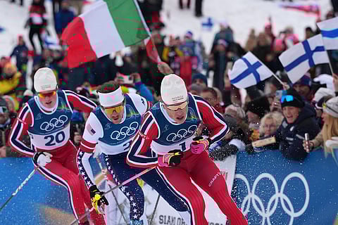 Johannes Hoesflot Klaebo, of Norway, from right, Ben Ogden, of the United States, and Oskar Opstad Vike, of Norway, compete in the final of the cross-country skiing men's sprint classic at the 2026 Winter Olympics, in Tesero, Italy.