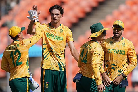 South Africa's Marco Jansen, centre, celebrates the dismissal of Afghanistan's captain Rashid Khanduring the T20 World Cup cricket match between Afghanistan and South Africa in Ahmedabad.