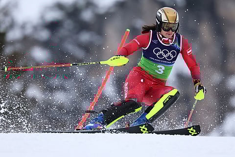 Austria's Katharina Huber speeds down the course during an alpine ski, slalom portion of a women's team combined race, at the 2026 Winter Olympics, in Cortina d'Ampezzo, Italy.
