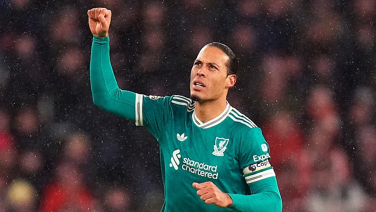 Liverpool's Virgil van Dijk celebrates scoring their side's first goal of the game during the English Premier League soccer match against Sunderland, in Sunderland, England, Wednesday, Feb. 11, 2026 - (Danny Lawson/PA via AP)