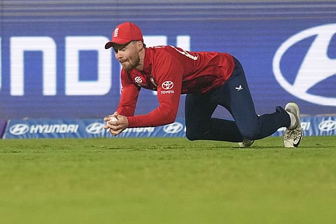 England's Phil Salt takes the catch to get dismiss West Indies' Brandon King during the T20 World Cup cricket match between England and West Indies in Mumbai, India.