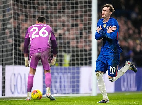 Chelsea's Cole Palmer, right, celebrates scoring his side's second goal of the game from a penalty against Leeds United's during an English Premier League soccer match in London.