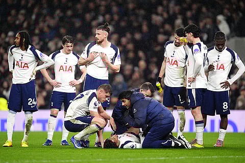 Tottenham Hotspur's Wilson Odobert receives medical treatment during a stop in play in a Premier League soccer match against Newcastle United London.