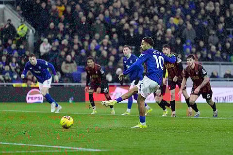 Everton's Iliman Ndiaye scores from the penalty spot against Bournemouth's during their English Premier League soccer match in Liverpool, England.
