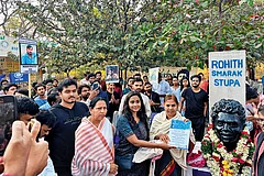 | Photo: Special arrangement : In Memory: Rohith Vemula’s mother standing next to his bust at Velivada, his memorial site on the HCU campus