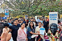 | Photo: Special arrangement : In Memory: Rohith Vemula’s mother standing next to his bust at Velivada, his memorial site on the HCU campus
