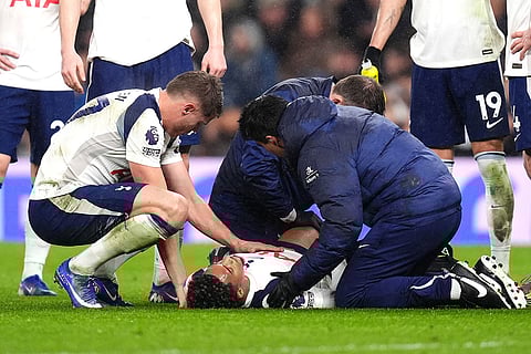 Tottenham Hotspur's Wilson Odobert receives medical treatment during a stop in play in a Premier League soccer match against Newcastle United London. 
