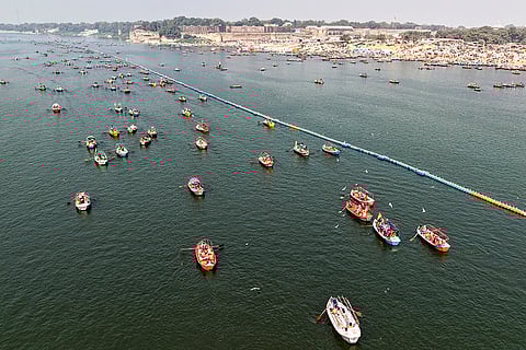 People take boat rides during the 'Magh Mela' festival, at the Sangam in Prayagraj, Uttar Pradesh.